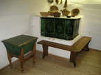Prezihov cottage - Prezihov Voranc Memorial Museum - the traditional ceramic heating stove 
