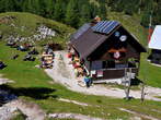 Blejska koca na Lipanci Mountain Hut - Tables and benches in front of the Blejska koca Mountain Hut 