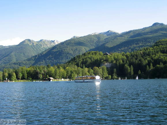 Tourist boat and Lower Bohinj mountains