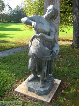 Statue of the woman near the house