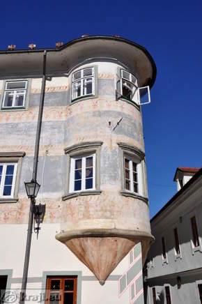 Ornamental balcony at house corner 