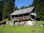 Dobrca - Koca na Dobrci mountain hut - View of old house on Podgorska planina mountain pasture 