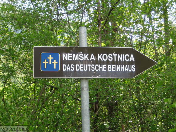 Direction sign for German Charnel House
