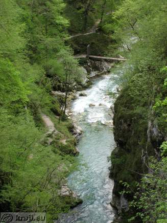 View of Tolminka and footbridge from the the road to Cadrg