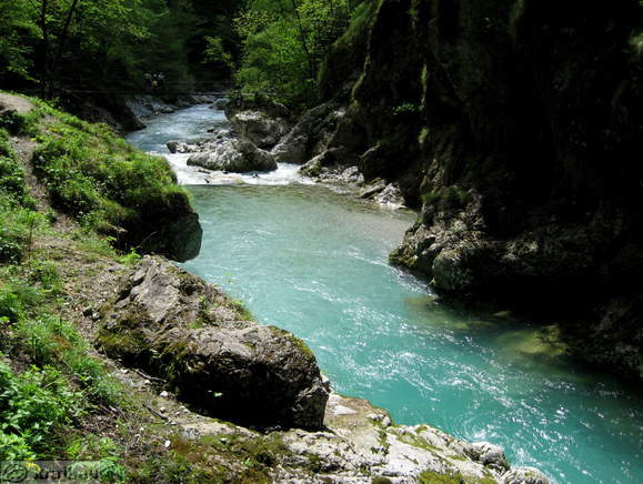 Tolminka with footbridge in the background
