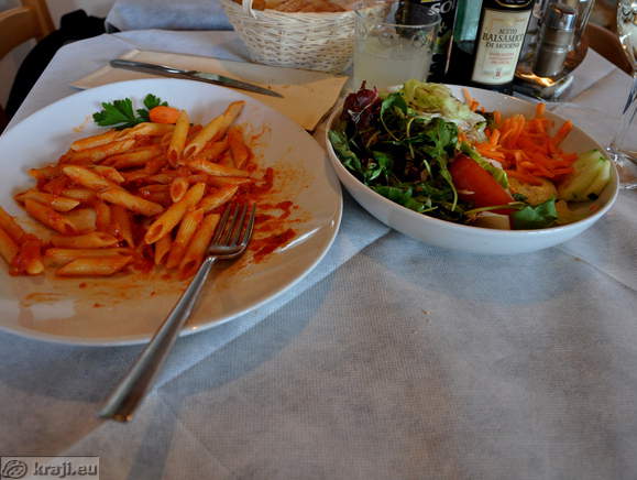 Pasta with tomato sauce and salad
