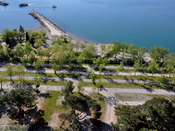 Parking area at beach on the west side of the Harbour of Sistiana