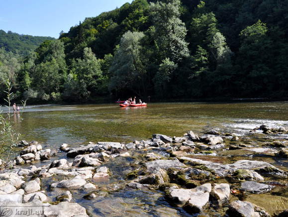 Boats on the Kolpa River at bathing area