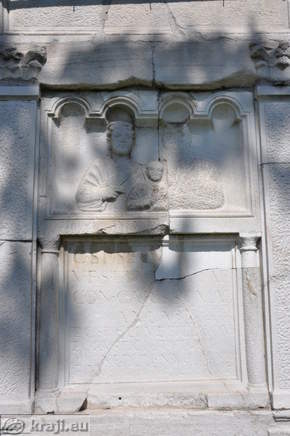 Figures and inscription on the front side