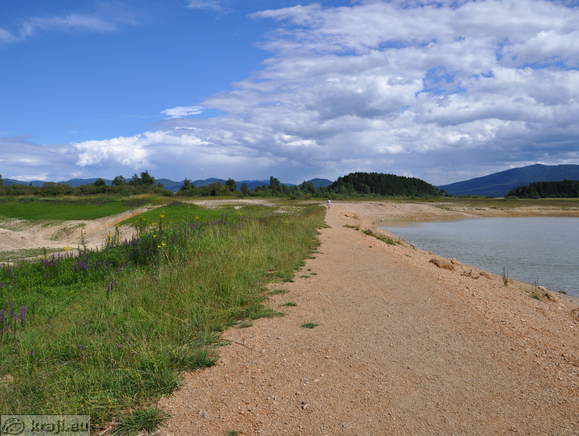 Reseto Sinkholes on the left and Lake Cerknica in summer on the right