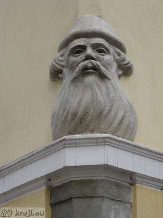 Statue on the corner of the house