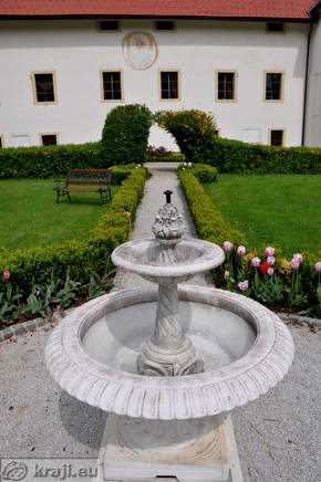 Fountain with the Tustanj Castle in the background