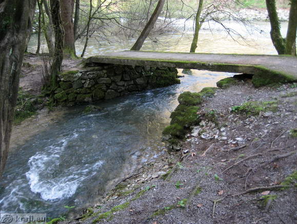 Small bridge over brook of one of the springs